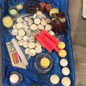 An assortment of candles and holders